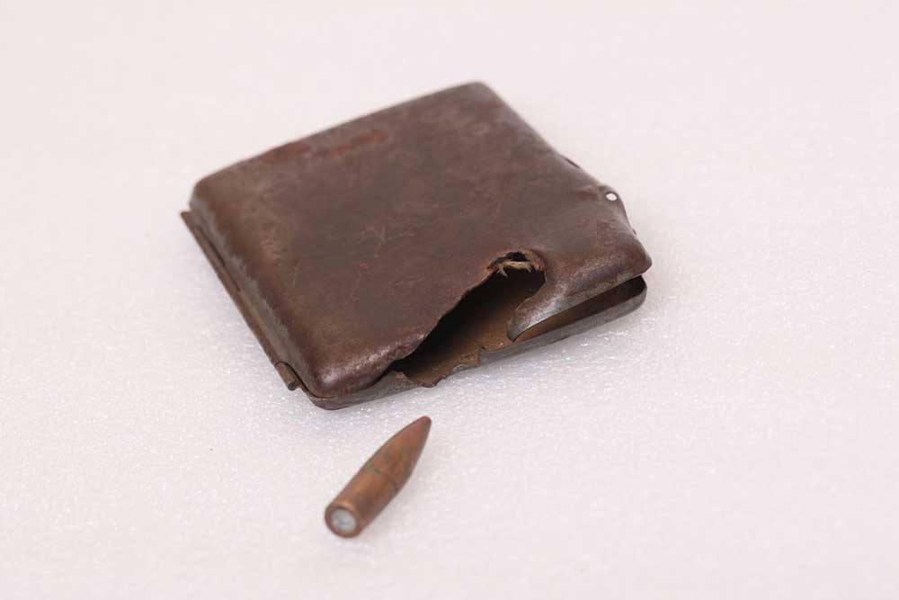 Harold G Traves cigarette case and bullet