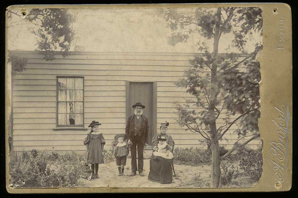 John Wilds and family outside his home in North Street, Timaru