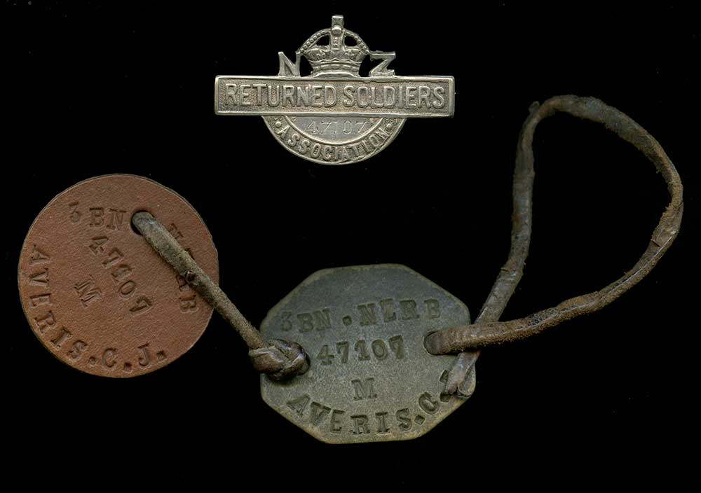 Dog tags and RSA badge belonging to Cecil Averis